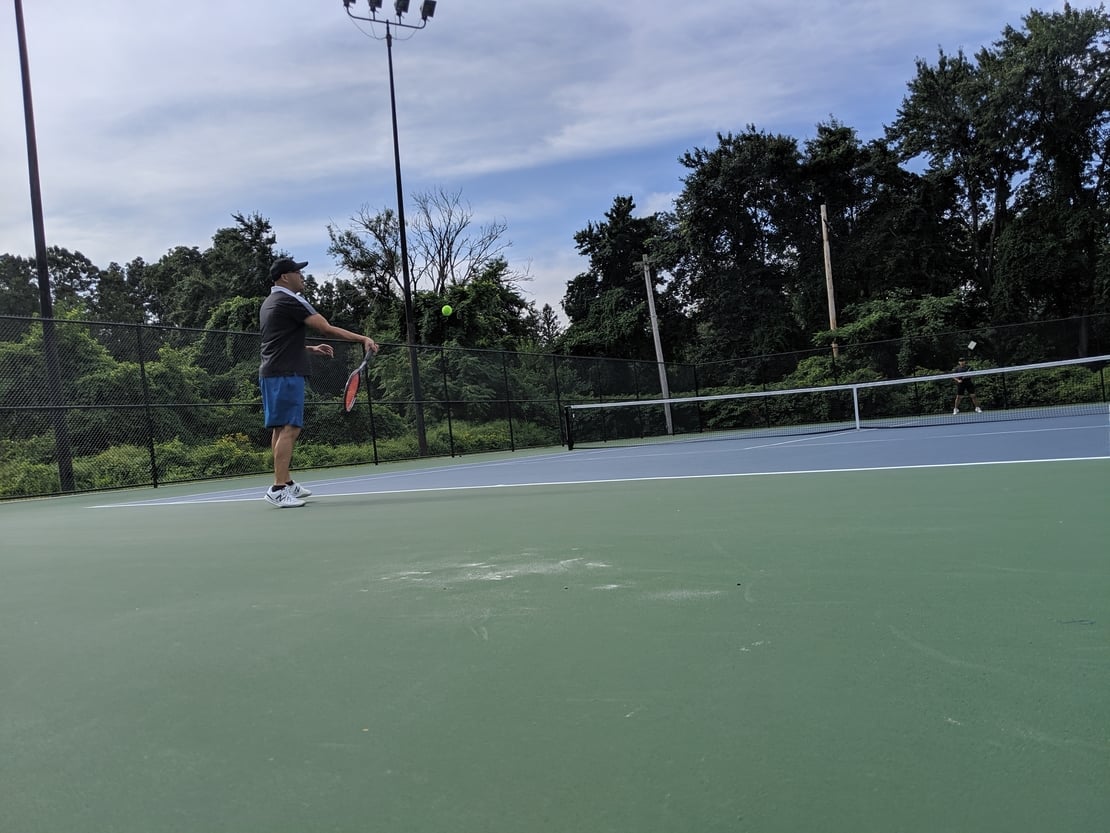 first round tennis player hitting a forehand