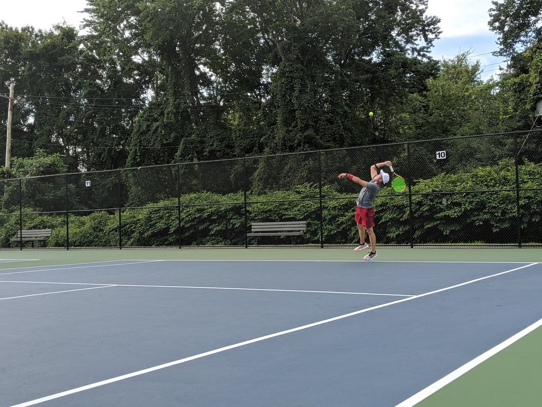 first round tennis player serving