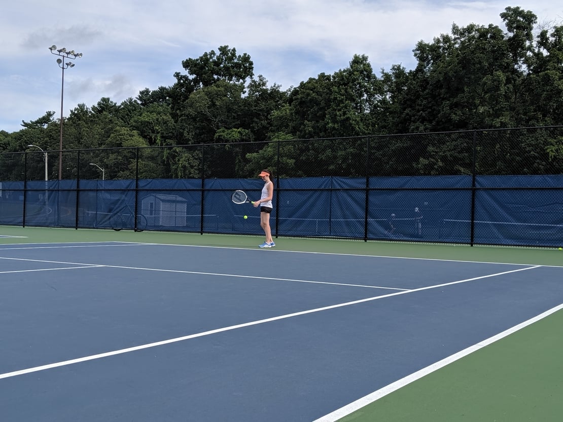 first round tennis player preparing to serve